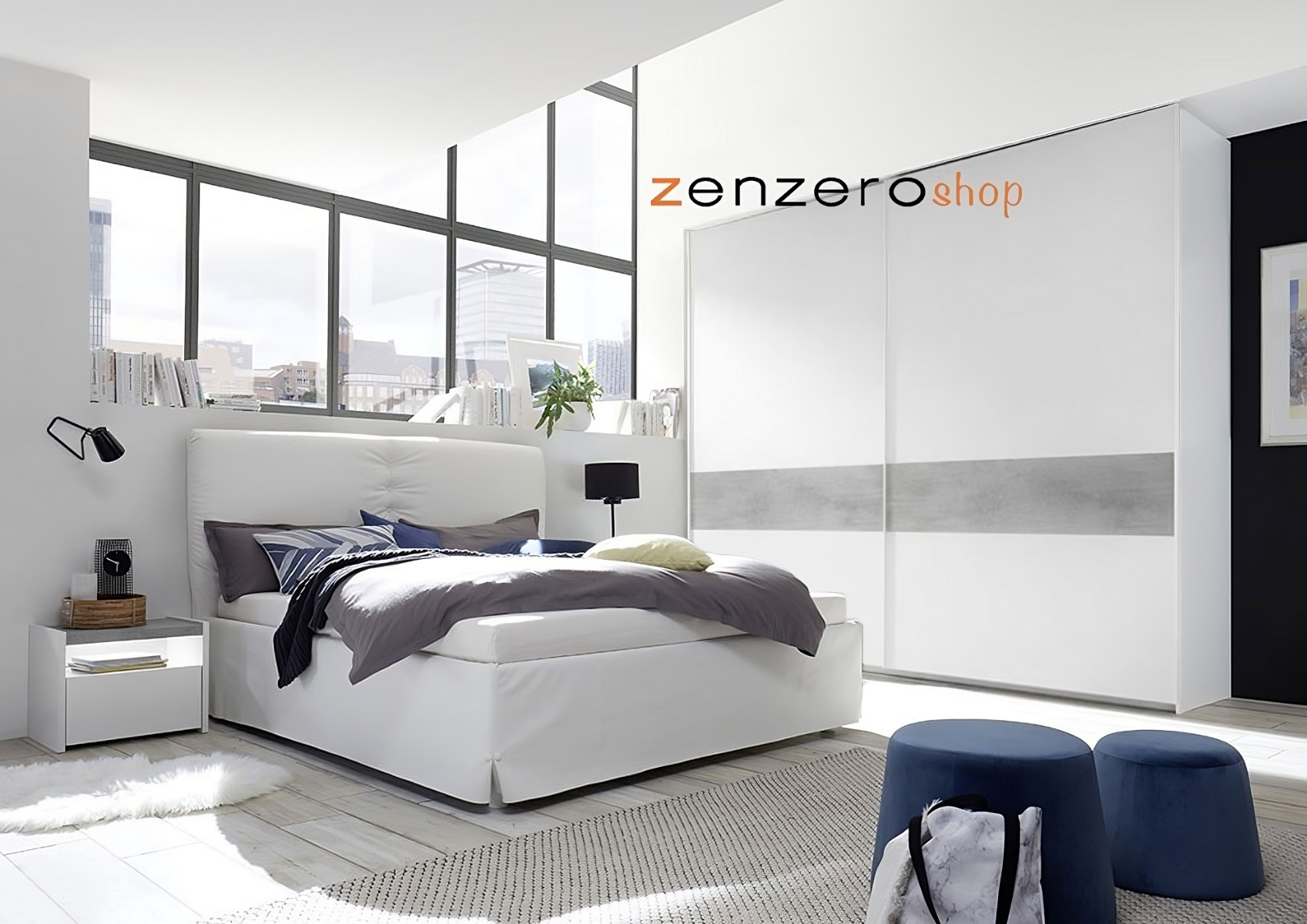 Camera matrimoniale con letto in ecopelle bianco, armadio con fascia beton e comodini bianchi opachi