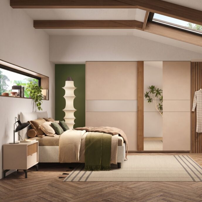 Camera matrimoniale con letto imbottito, armadio scorrevole e comodini