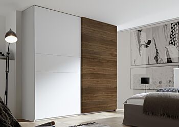 Camera matrimoniale con letto in ecopelle tabacco, armadio con anta noce dark H.248 e comodini bianchi opachi