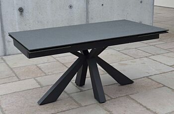 Tavolo di design allungabile con piano in vetro ceramica finitura pietra nera