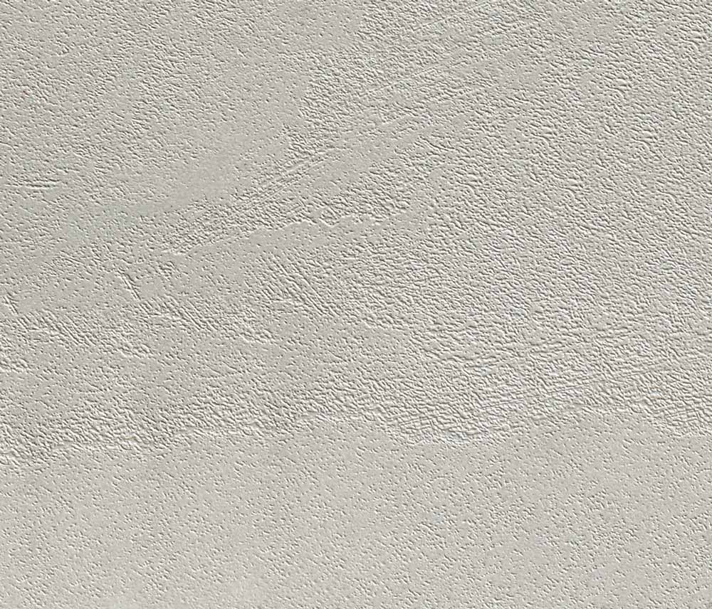 Tavolo di prestigio con piano materico cemento chiaro